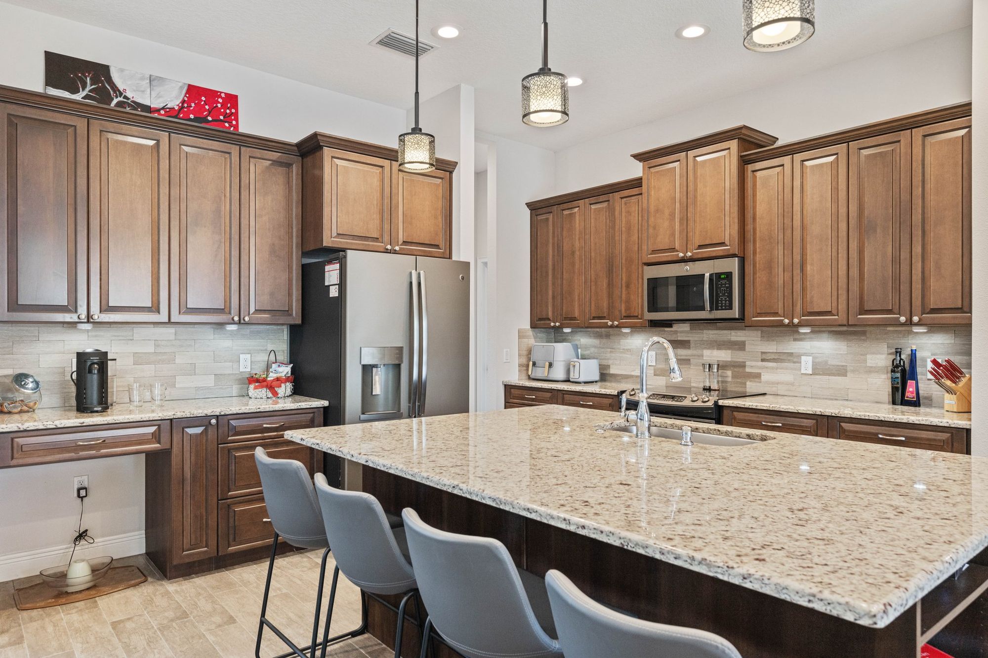 Kitchen island with granite and wood cabinets