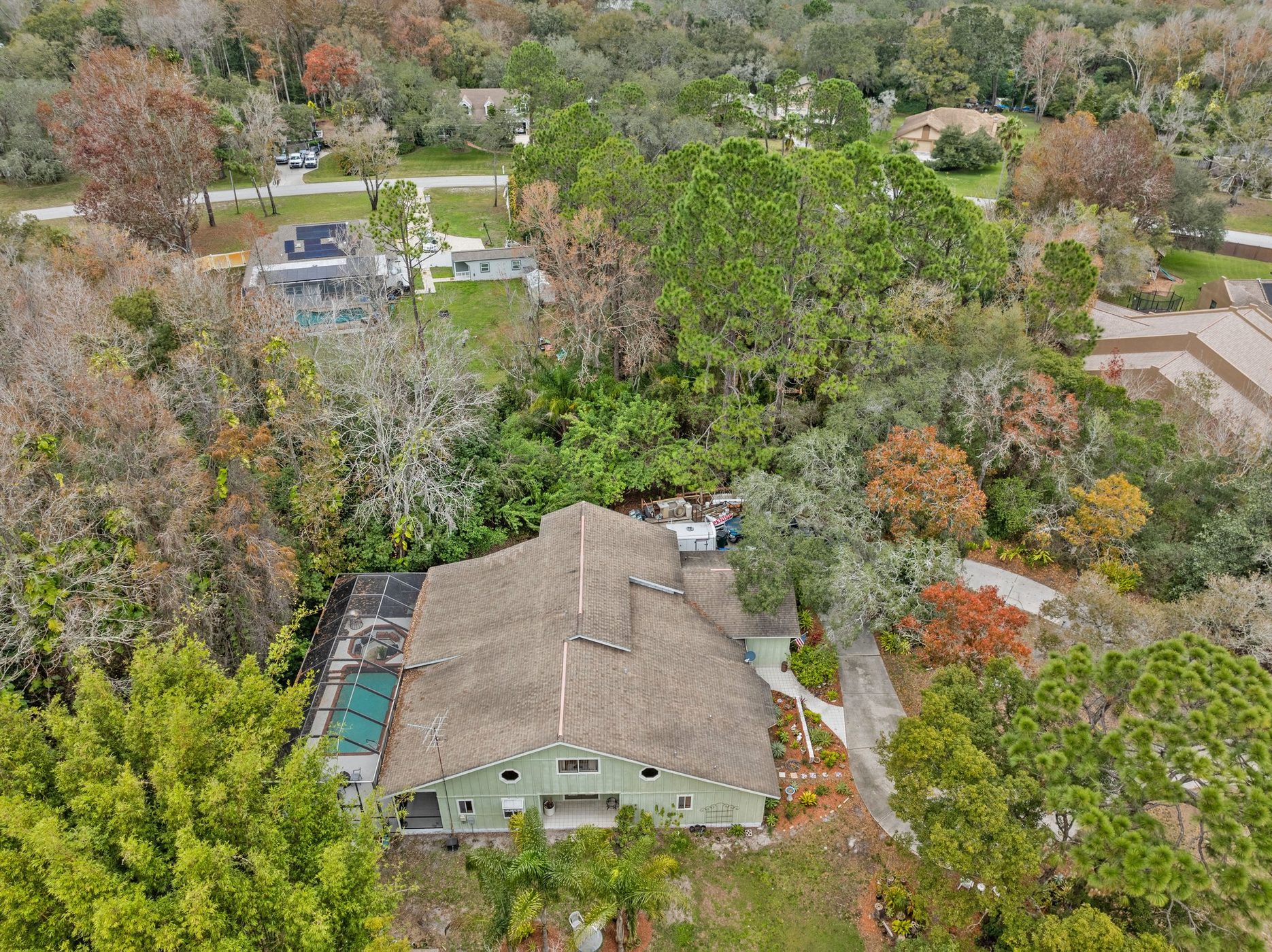 Aerial showing the screened pool beside the house