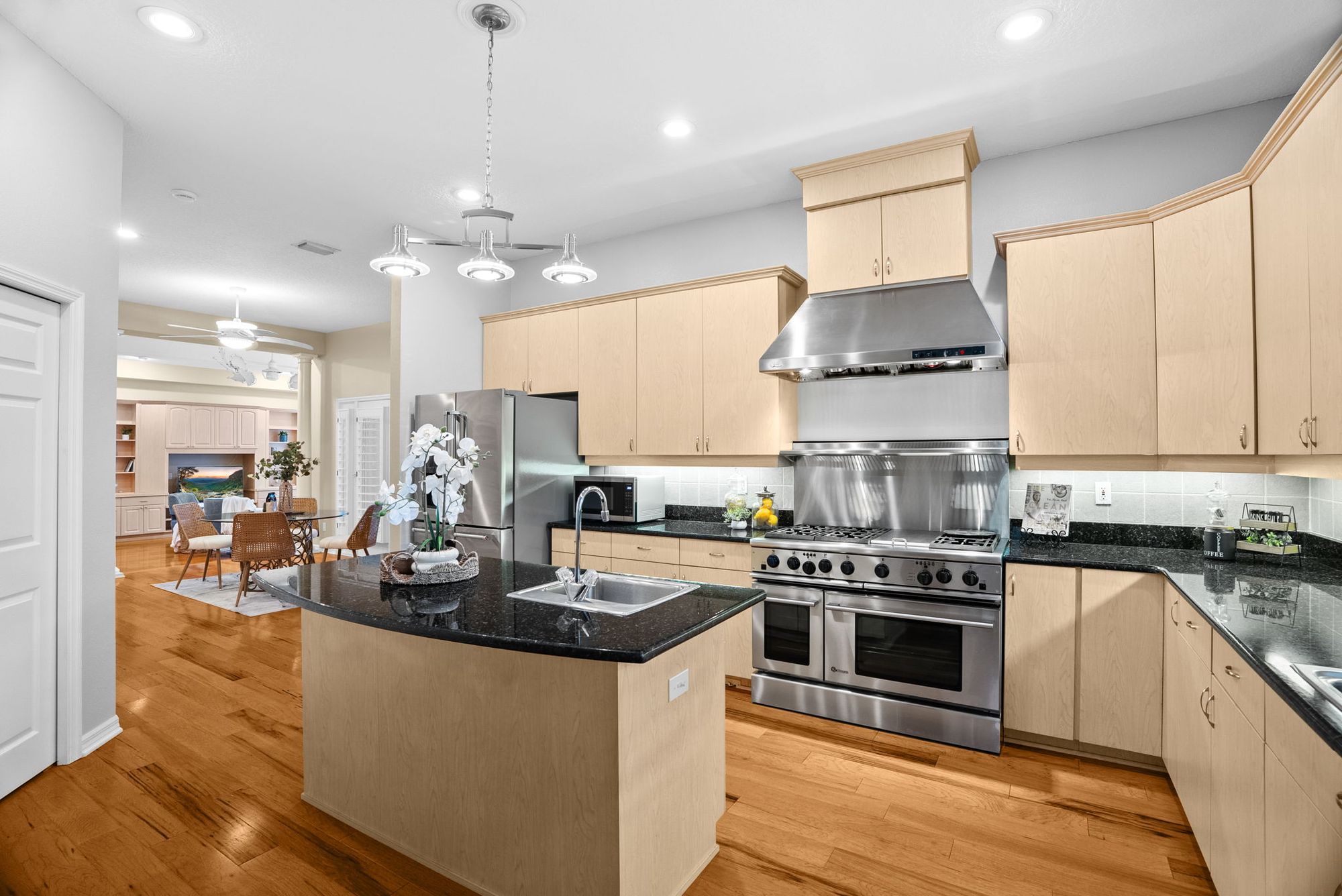 Kitchen with a Monogram range and prep island