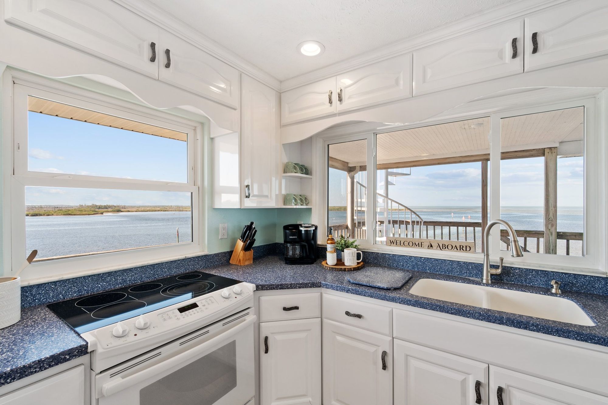 Kitchen looking out to the deck and the water